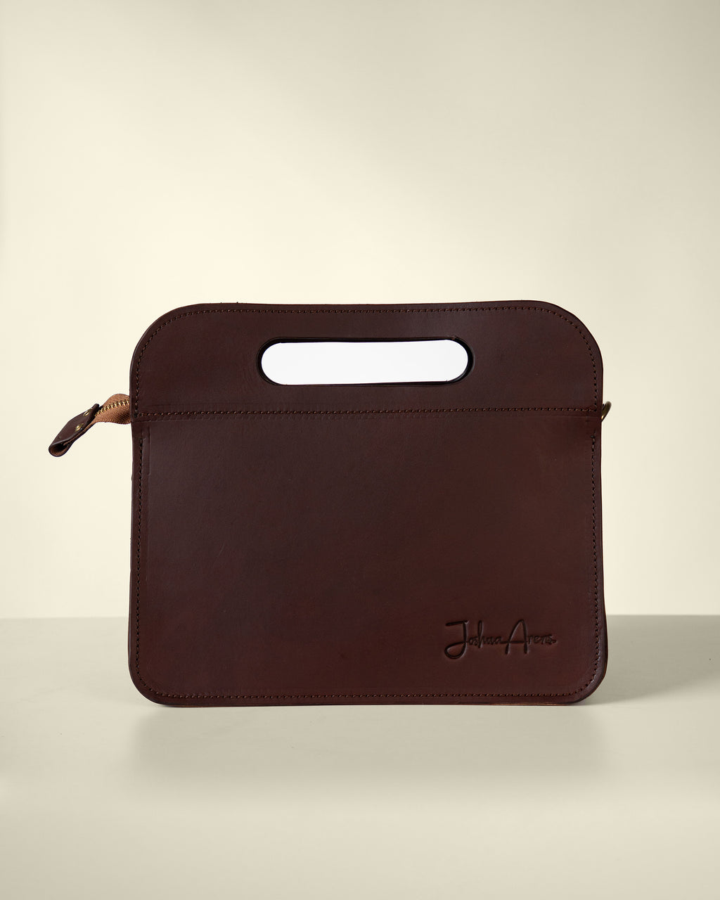Leather handbag with carrying handle