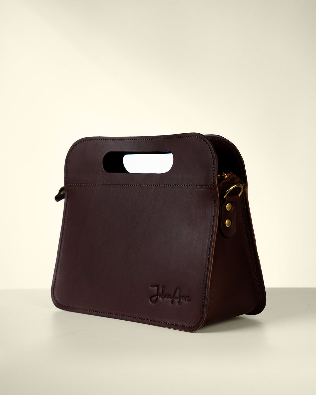 Leather handbag with carrying handle